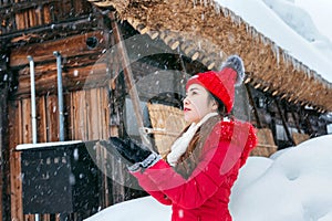 Young woman in Shirakawa-go village in winter, UNESCO world heritage sites, Japan