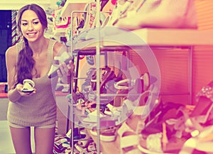 Young woman in shoes store