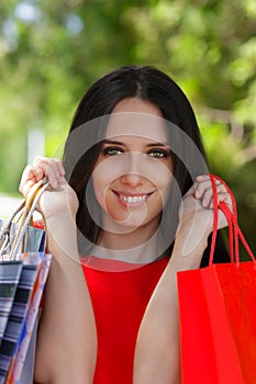 Young Woman with Shopping Bags Close-Up