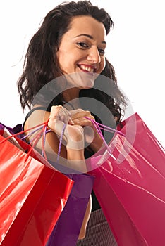 Young woman with shopping bags close-up isolated