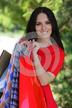 Young Woman with Shopping Bags Outside
