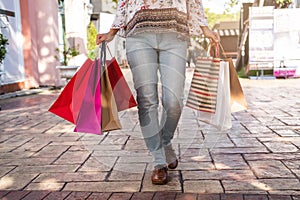 Young woman with shopping bags at shopping mall