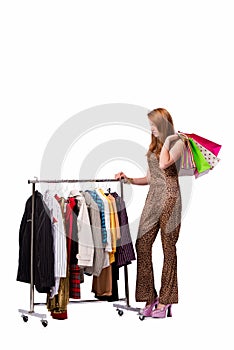 The young woman in shopping concept on white