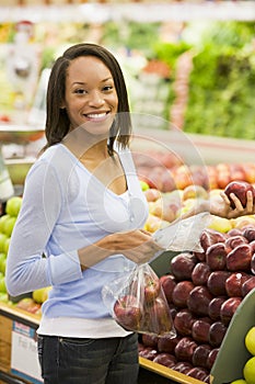 Young woman shopping for fresh produce