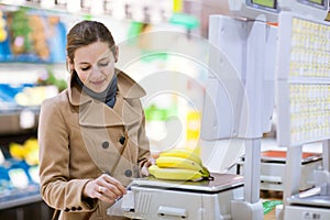Young woman shopping for fruits and vegetables