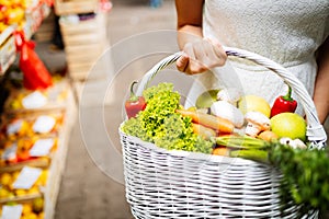 Young woman shopping healthy food on the market