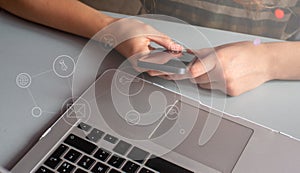 Young woman shopping  on line, Using smart phone and laptop computer