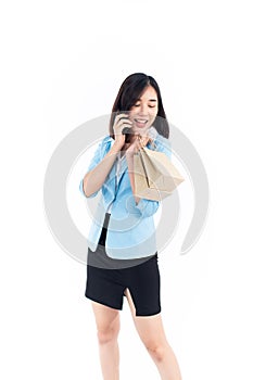 Young woman shopping and make a phone call