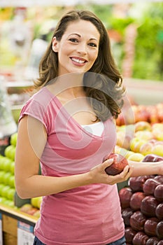 Young woman shopping in produce department