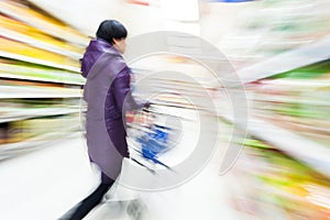 Young woman shopping in the supermarket