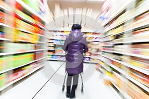 Young woman shopping in the supermarket