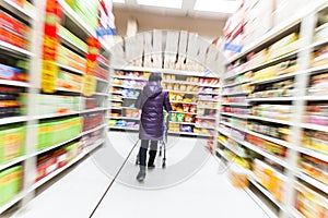 Young woman shopping in the supermarket