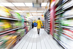 Young woman shopping in the supermarket