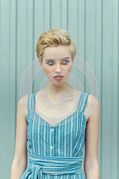 young woman with short hair posing in trendy