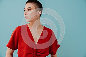 Young woman with short haircut smiling and looking aside