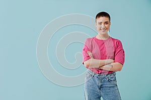 Young woman with short haircut smiling and looking at camera