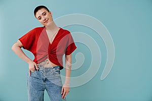 Young woman with short haircut smiling and looking at camera