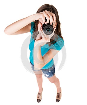 Young woman in shorts photographed something compact camera.