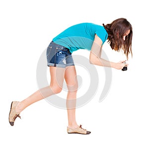 Young woman in shorts photographed something compact camera.