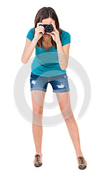 Young woman in shorts photographed something compact camera.