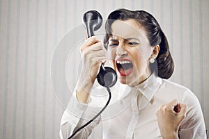 Young Woman shouting into telephone