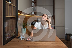 Young woman shouting trying to not to hear the loud noise from neighbor apartment in building while they renovate home and she photo