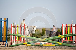 Young woman show jumping