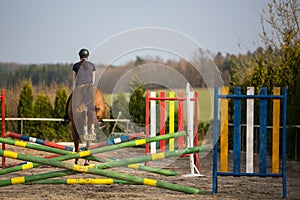 Young woman show jumping