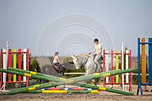 Young woman show jumping