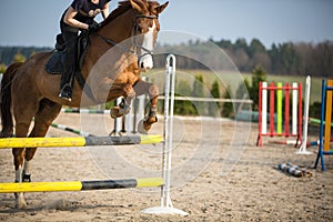 Young woman show jumping