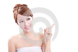 Young woman showing beauty product