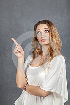 Young woman showing disapproval with finger