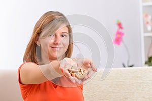 Young woman showing her deaf aids