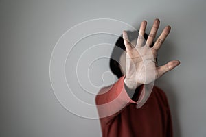 Young woman showing her denial with NO on her hand