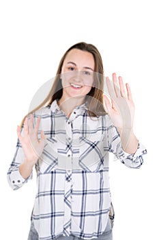 Young woman showing her denial with no sign with palm hand