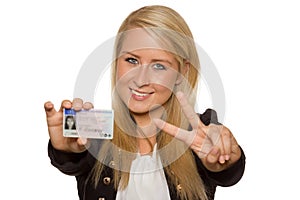 Young woman showing her driver's license