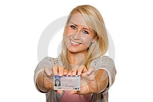 Young woman showing her driver's license