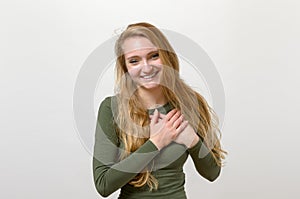 Young woman showing her heartfelt gratitude photo