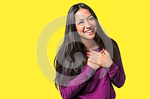 Young woman showing her heartfelt gratitude photo