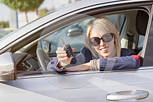 Young woman showing her new car keys