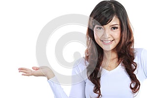 Young woman showing a imaginary product