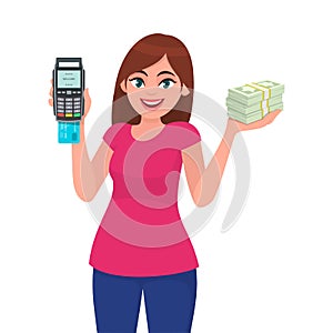 Young woman showing pos terminal or credit/debit cards swiping machine and holding bundle of cash/money/currency notes.