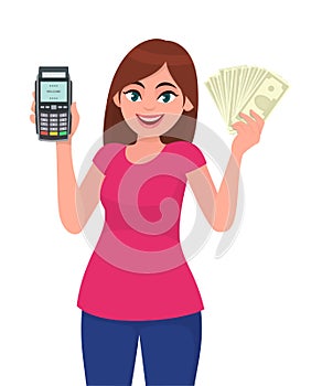 Young woman showing pos terminal or credit/debit cards swiping machine and holding cash/money/currency notes. Wireless modern bank