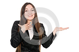 Young woman showing product with open hand palm