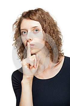 Young woman showing silence sign