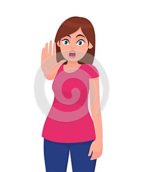 Young woman showing stop gesture sign with palm of the hand. Young girl requiring stop with her hand. Prohibition symbol.