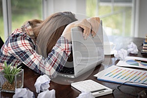 Young woman showing stress while working, failure to work