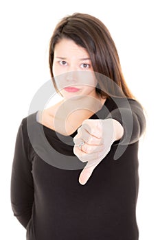 Young woman showing thumb down on white background