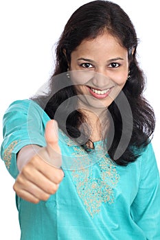 Young woman showing thumbs up