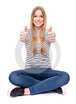 Young woman showing thumbs up